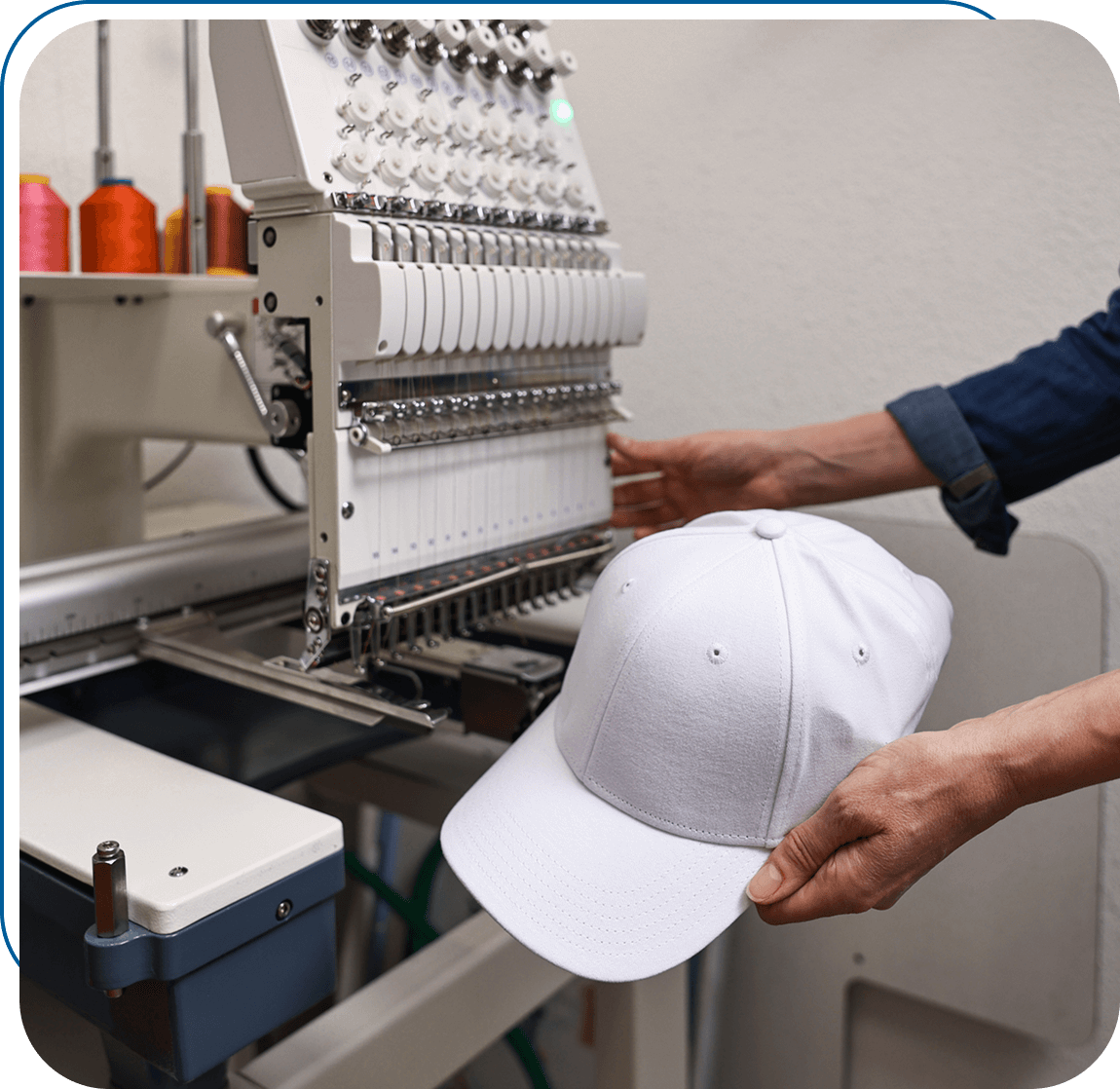Machine embroidery on a white baseball cap.