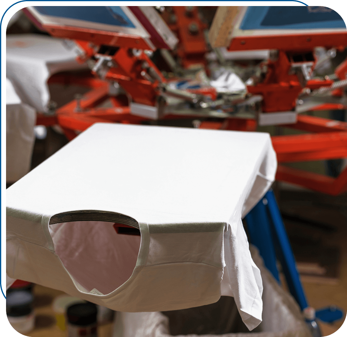 White t-shirt on screen printing machine.